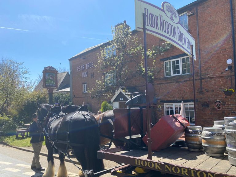 Shire Horses delivering beer to The Pear Tree Inn at Hook Norton