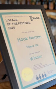 Tower Ale triumphs! Hook Norton Brewery celebrates their win at the 18th Moreton Beer & Cider Festival in Gloucestershire.